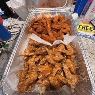 Slappin&apos; mild (top) and slappin&apos; spicy garlic (bottom) full wings