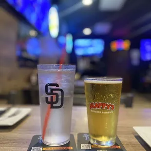 two glasses of beer on a table