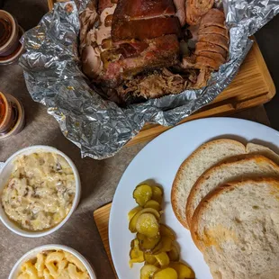 Sampler's Plate (brisket, pulled pork, turkey, jalepeno sausage, ribs) with potato casserole and bacon mac + cheese.