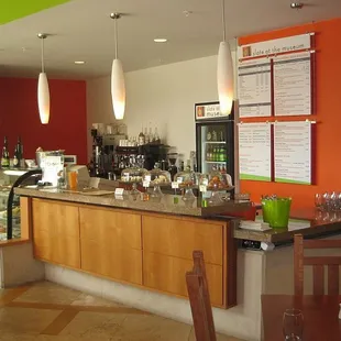 a bar with a menu on the wall