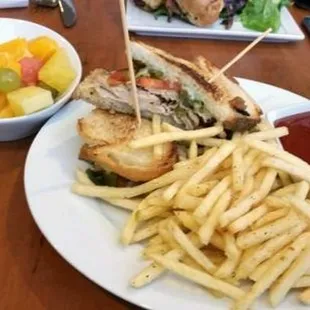 a plate of french fries and a sandwich