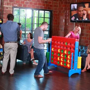 a group of people playing a board game