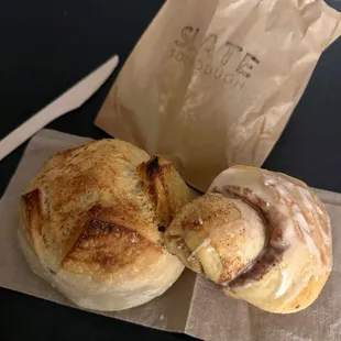 A mini sour dough boule and small cinnamon roll.