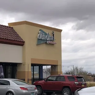 a parking lot with cars parked in front