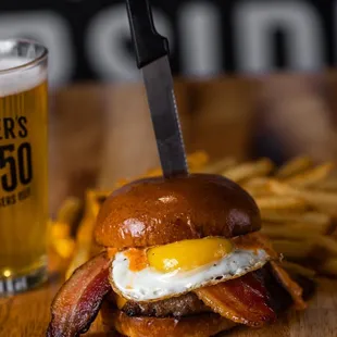 B&apos;B&apos;B&apos; BACON! Our signature 50/50 beef and BACON blend, BACON American cheese, thick-cut BACON, sunny-side up egg, and BACON island dressing