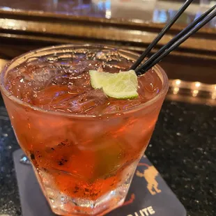 a drink with chopsticks