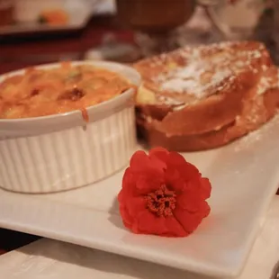 a plate of pastries and a flower