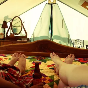 two people laying on a bed