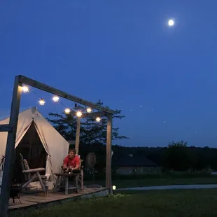 Evening shot of out tent under a full moon.