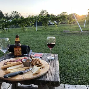 Cheese tray, wine, and sunset. View from the porch of our tent.