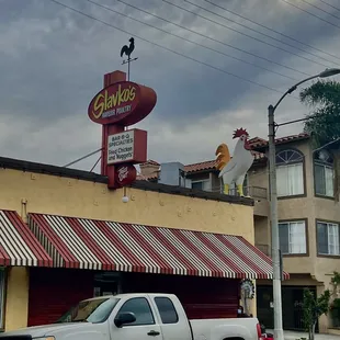 a truck parked in front of a restaurant