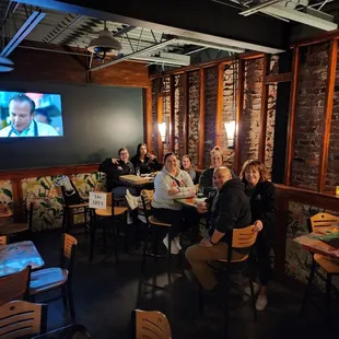 a group of people sitting around a table