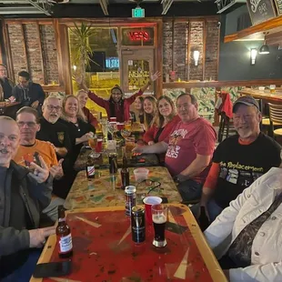 a group of people sitting at a table