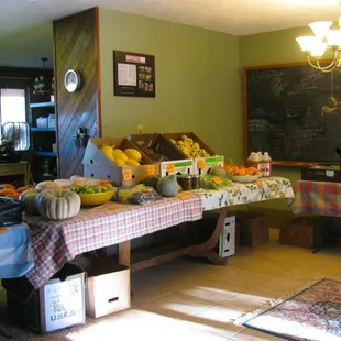 a man standing in front of a fruit stand