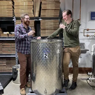 two men in a brewery