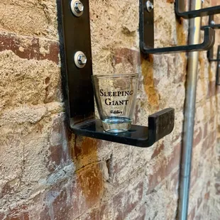 a shot glass on a shelf