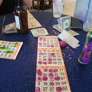 a table with a lottoons and a bottle of beer