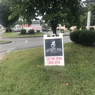 Sign out front saying it is open but no one is home.