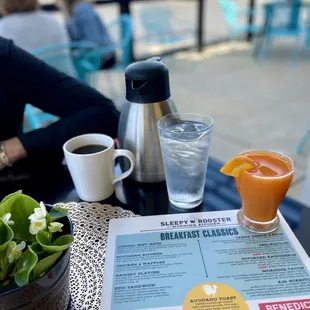 a menu and a cup of coffee