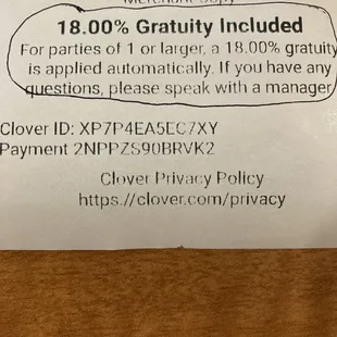 Receipt explaining that everyone gets charged an 18% gratuity.