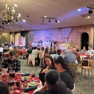 a crowd of people sitting at tables