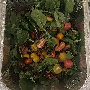 Fresh baby spinach salad with red and yellow grape tomatoes, walnut halves and cranberry raisins!