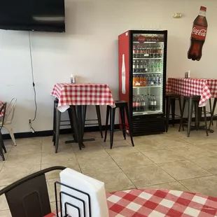 Plenty of tables and chairs and a nice TV