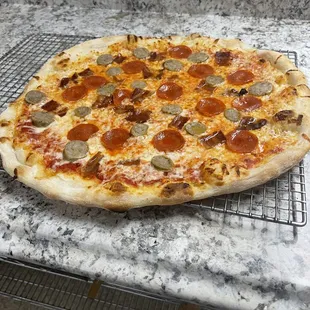 Meateterian pizza, pepperoni, sausage, and bacon