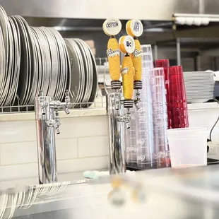 a counter with plates and cups