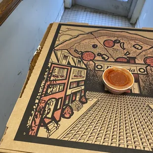 side of box covered with cheese and grease before leaving restaurant