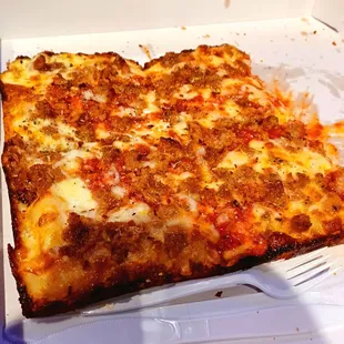 Detroit style cheese pizza with sausage