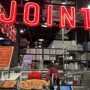 the inside of a pizza shop