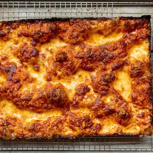 a square of pizza on a cooling rack