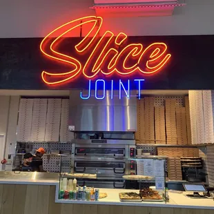 the neon sign above the counter