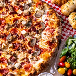 MEAT LOVERS: 
Fresh Pizza Sauce, Mozzarella, Pepperoni, Bacon, Chicken, Meatball, Sausage