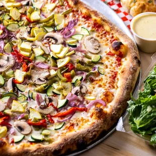 VEGGIE:
Fresh Pizza Sauce, Mozzarella, Squash &amp; Zucchini Mix, Red Pepper, Green Pepper, Red Onion, Mushroom