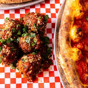 GRANDMA'S MEATBALLS:
Handmade Beef, Pork &amp; Veal Meatballs, Marinara, Shaved Parmesan and Basil.