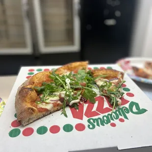 a pizza in a pizza box