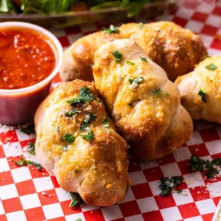 GARLIC KNOTS: 
Olive Oil, Garlic, Parsley, Parmesan Cheese. Served with Marinara.