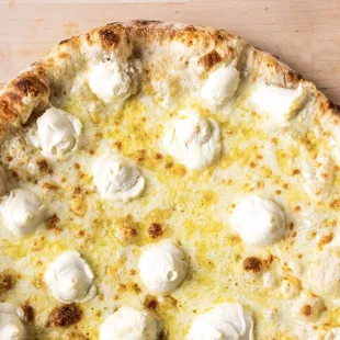 FOUR CHEESE:
Garlic Herbed Oil, Mozzarella, Fontina, Parmesan, Ricotta