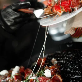 a person holding a plate of food