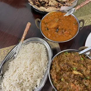 Bottom: baingan bartha  Middle: mixed veggie masala Top: garlic naan and aloo paratha
