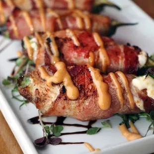 bacon wrapped in cheese and sauce