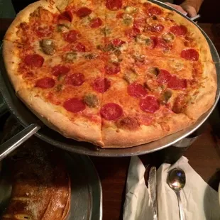 Pizza with pepperoni and sausage.