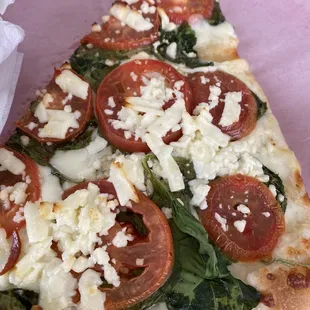 Roma Spinach Pizza slice