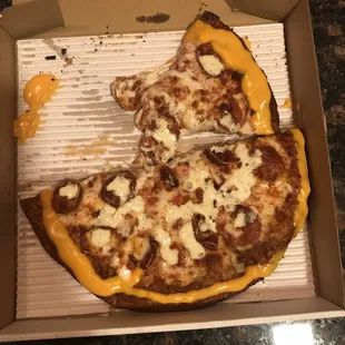 Pepperoni, bacon, ranch drizzle, Cajun nacho cheese crust