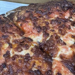 Overcooked cheese pizza with Cajun crust