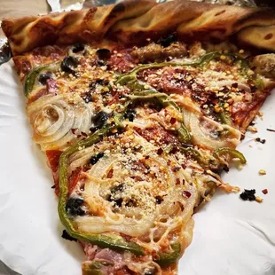 Supreme pizza topped with pepper and cheese.