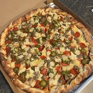 18" pepperoni, sausage, jalapeño &amp; pineapple pie from Slice of Waikiki