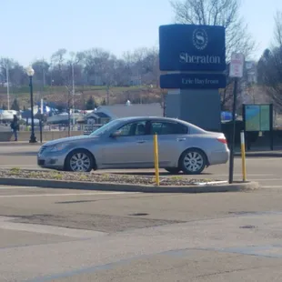 a silver car parked in a parking lot